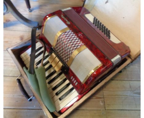 A small cased Galotta 48 button piano accordion 