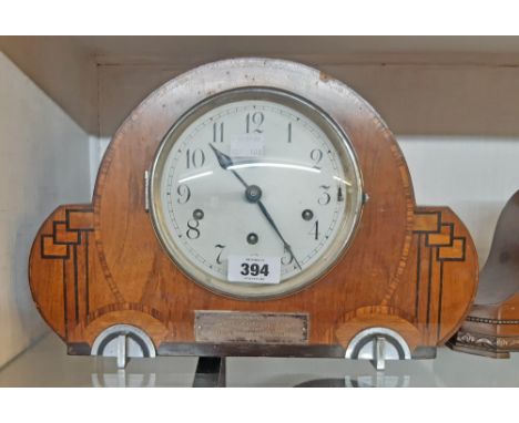 A 1930`s inlaid walnut Art Deco mantel clock with eight day chiming movement - bearing presentation plaque - some veneer loss