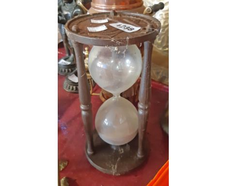 A modern reproduction cast iron egg timer