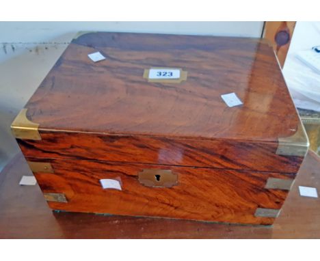 A 12" 19th Century walnut writing slope with brass bound corners and escutcheons, the fitted interior with secret drawer and 