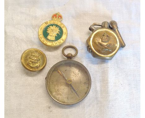 A Women's Land Army badge, a RAF trench art lighter, a Victorian pocket compass and a Royal Navy button
