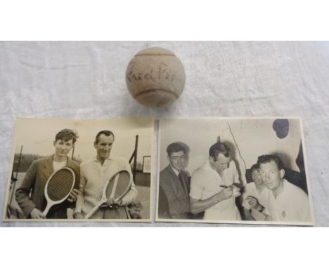 A vintage Slazenger tennis ball bearing Fred Perry's autograph - sold with a contemporary photograph of Mr Perry signing a te