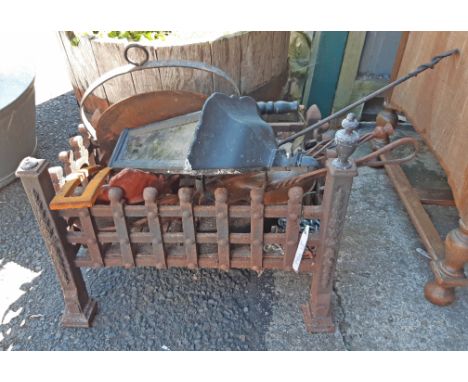 Assorted metalware including cast iron fire grate, skillet, kettle, outside lamp, etc.