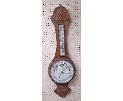 A carved oak cased banjo barometer/thermometer with printed ceramic dial and scale - repair 