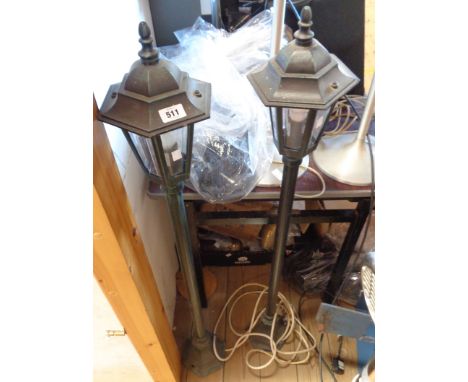 A pair of modern street lamp style standard lamps