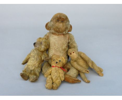 A Merrythought plush monkey, probably 1950s, with stitched label, length 37cm, together with another monkey and two vintage t