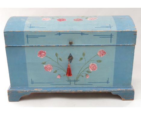 An Eastern European blue painted marriage chest, 19th century, with a domed top and painted with floral sprays, on bracket fe