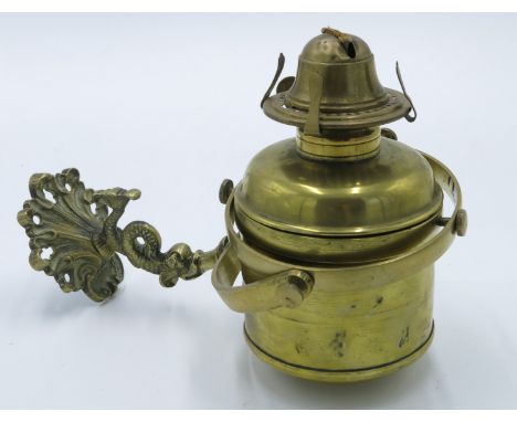 A ship's brass gimbal wall oil lamp with weighted reservoir, early 20th century, with dolphin cast bracket.