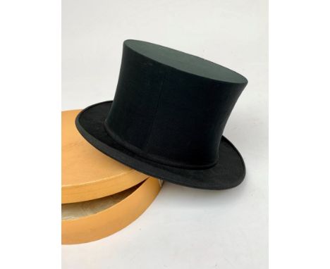 A collapsible opera hat, by Austin Reed, original card box together with a walking stick.