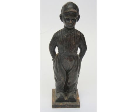 A cast iron Fireside companion set, modelled as a Dutch boy, in clogs, lacking fire tools, height 53cm.