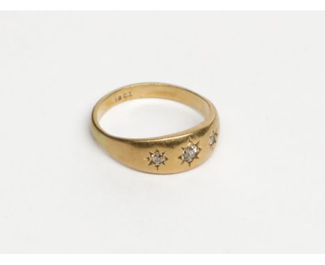 An 18ct gold ring, gypsy set three diamonds, 4.5g.