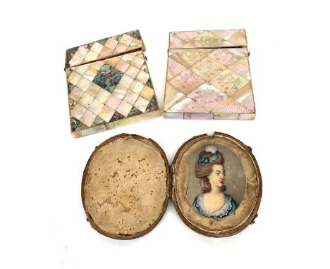 A George III oval miniature portrait of a lady wearing a lace trimmed blue dress, inscribed 'Goldfinch', 6 x 4.5cm, together 