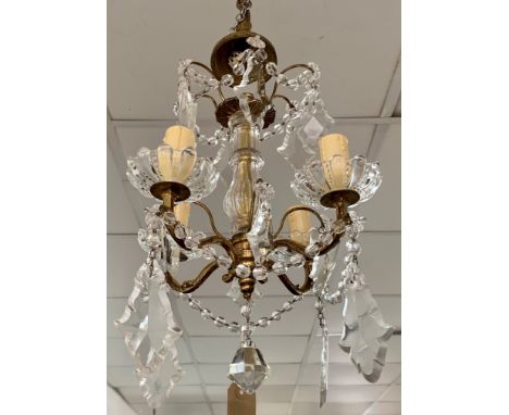 A cut glass four branch chandelier, with gilt arms and flattened hanging drops, height 35cm.