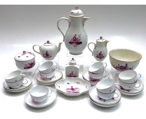 A Meissen porcelain tea and coffee service, 18th century, decorated in purple enamels with ducks and other birds, gilt rims.