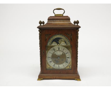 A walnut moon phase bracket clock, with pineapple finials, gilt metal mounts and fitted with a German movement, height 48cm, 