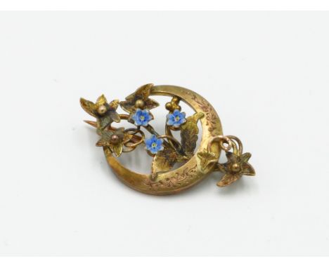 A Victorian 9ct gold and enamel aesthetic movement brooch, hallmark 1889.