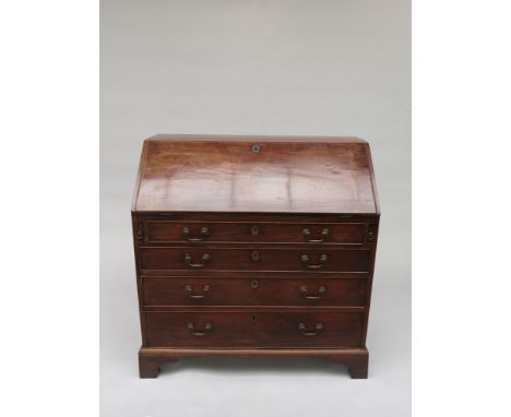 A George III mahogany bureau, the fall front opening to reveal a fitted interior above four long graduated drawers, on bracke