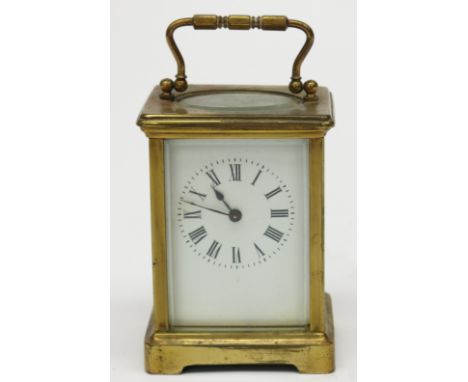 A French brass cased carriage clock, white enamel dial, stamped G.H. to underside, height 11cm