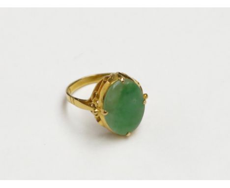 A Chinese high purity gold jade set ring.