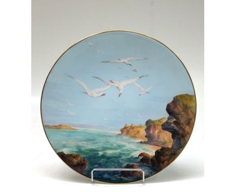 A fine Royal Worcester porcelain plaque, decorated with a coastal scene and seagulls, signed Walter Sedgley, diameter 30cm. C