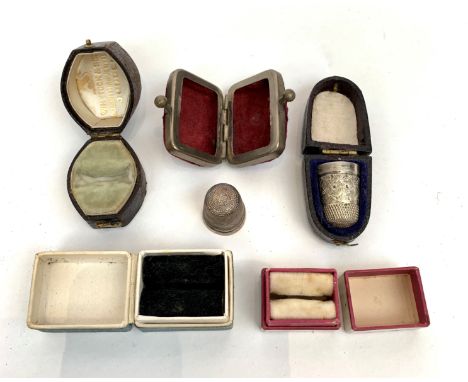 Two silver thimbles and cases together with three ring boxes.