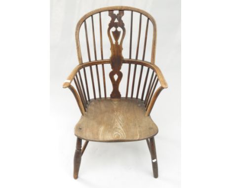 An ash and elm Windsor armchair, with a pierced vertical splat and stick filled back, height 94cm.  Condition report: With on