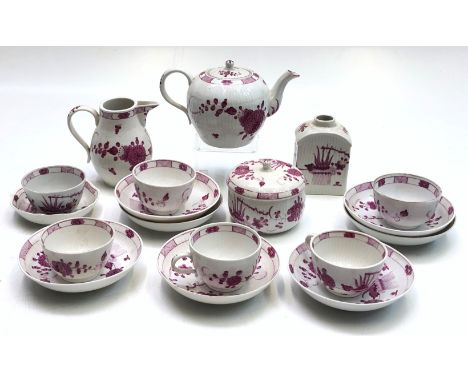 A German porcelain part tea service, 18th century, floral decorated in purple and gold, possibly Limbach, underglaze blue fac