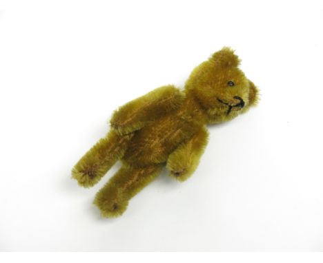 A rare Schuco plush teddy bear brooch, the pin fixed to the back, marked Schuco Patent, made in Germany, height 9.2cm Conditi