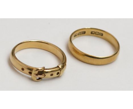 A high purity gold buckle ring, tests as 18ct together with a plain 18ct gold band, 10.5g.