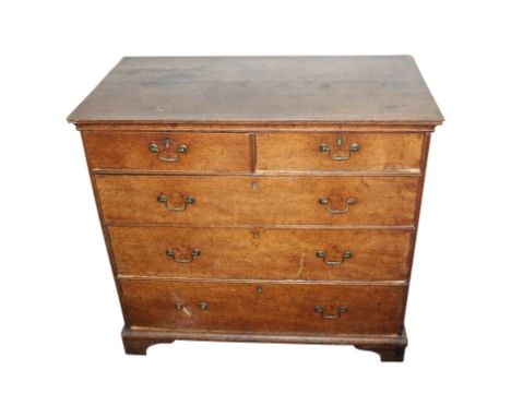 A George III oak chest of drawers, with two short and three long drawers on bracket feet, height 90cm, width 97.5cm, depth 53