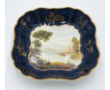 A Royal Worcester porcelain dessert dish, of shaped square section, with blue and gilt border, centrally painted by Johnson w