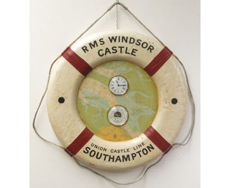 A Ship's life ring, painted 'RMS Windsor Castle Union Castle line Southampton', internally containing an aneroid barometer an