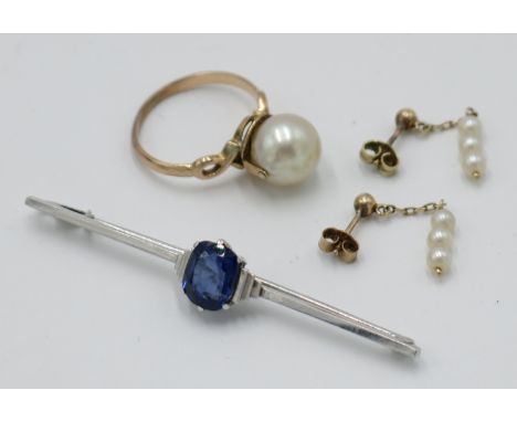 An Art Deco white gold bar brooch, set a blue stone, together with a gold ring, set a pearl and a pair of pearl earrings.