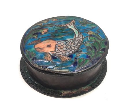 An Arts and Crafts copper and enamelled circular box and cover, the cover decorated with a fish amongst seaweed, height 4cm, 