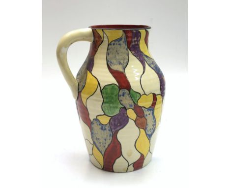 A large Clarice Cliff Bizarre Lotus shape jug, decorated with a leaf design, height 30cm. Condition report: Degradation to bl
