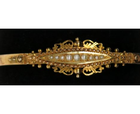 A 15ct gold late Victorian hinged bangle set with graduated pearls, 8.4g, hallmark Chester 1899. Condition report: Hinge and 