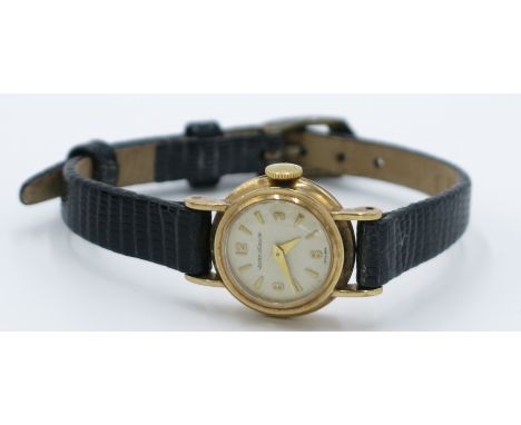 A ladies Jaeger-LeCoultre 9ct gold cased wristwatch, the back numbered 8302, diameter 19.4mm.