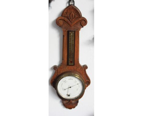 A Late Victorian walnut wall barometer, length 48cm.