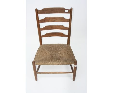 A ladder back armchair in Cotswolds style.