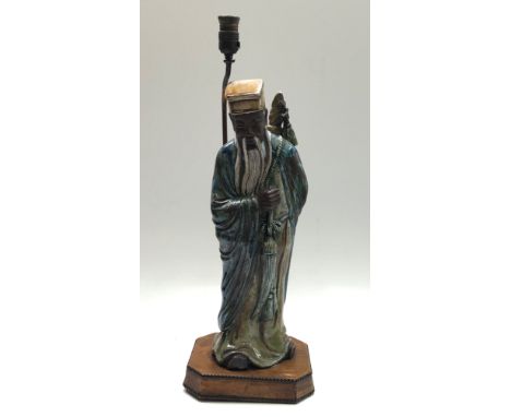A ;large Chinese pottery figural lamp, on a leather covered plinth, height 74.5cm . Condition report: No damage to figure. Le