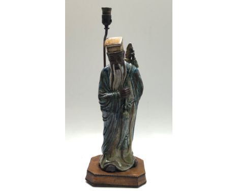 A ;large Chinese pottery figural lamp, on a leather covered plinth, height 74.5cm . Condition report: No damage to figure. Le