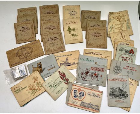 A Collection of cigarette cards, mainly in albums, including Carreras famous airmen and women, history of army uniforms, Will