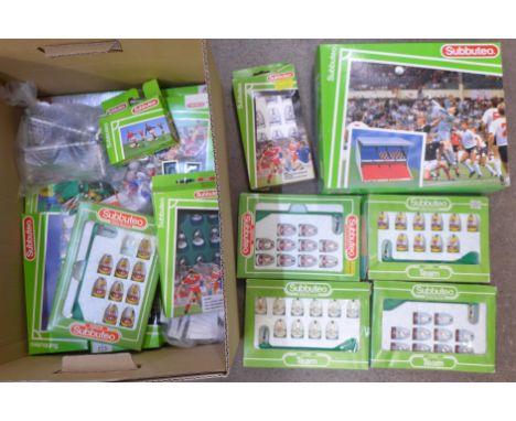 A collection of Subbuteo sets and a stadium, accessories and teams including Queens Park Rangers and Luton Town, etc. 