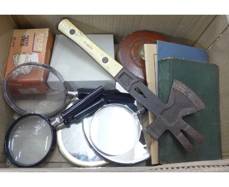 A German pallet axe, a War issue surveyor's tape measure, a Handbook of Signalling, 1913, other pamphlets and mini vice, four