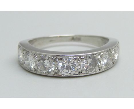 An 18ct white gold and seven stone diamond half-eternity ring, seven brilliant cut diamonds, 0.20pts each, total diamond cont