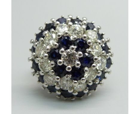 An 18ct white gold, sapphire and diamond cluster ring, 22 sapphires plus 13 brilliant cut diamonds, total diamond weight 2cts