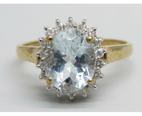 A 9ct gold, aquamarine and diamond cluster ring, 3.1g, T 