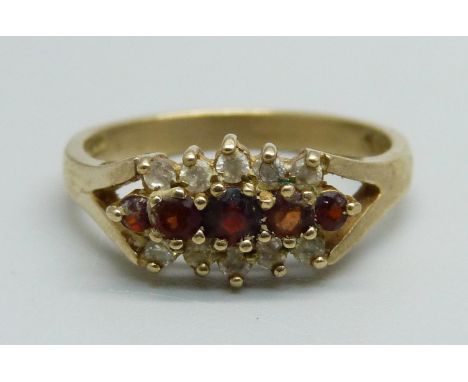 A 9ct gold, white stone and garnet ring, 3.3g, P 