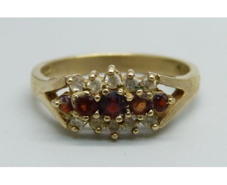 A 9ct gold, white stone and garnet ring, 3.3g, P 