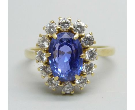 An 18ct gold, sapphire and diamond cluster ring, oval Ceylon sapphire, sapphire estimated 2.92ct weight, estimated 0.78ct dia